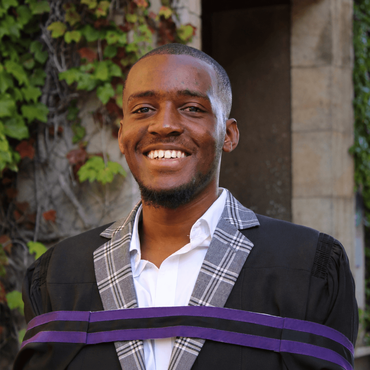 Portrait of Tino Muzambi in graduation attire